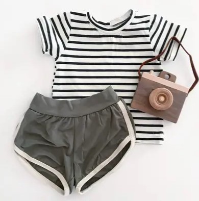 Bohemian Babies Black-Striped White Tee with shorts and a wooden camera